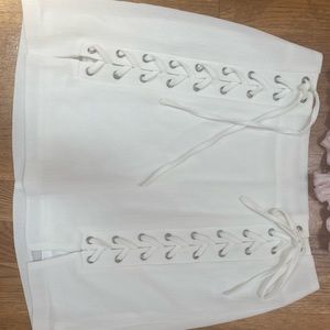 White body on tie front cross cross skirt